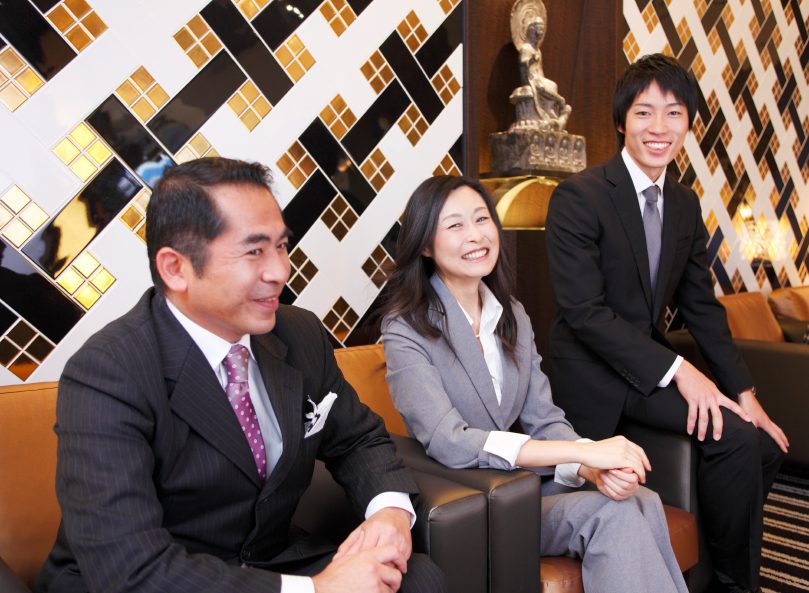 Corporate team in formal attire smiling