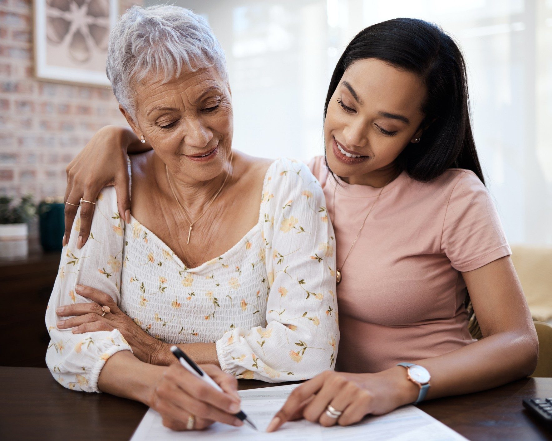 Two women collaborating at a table